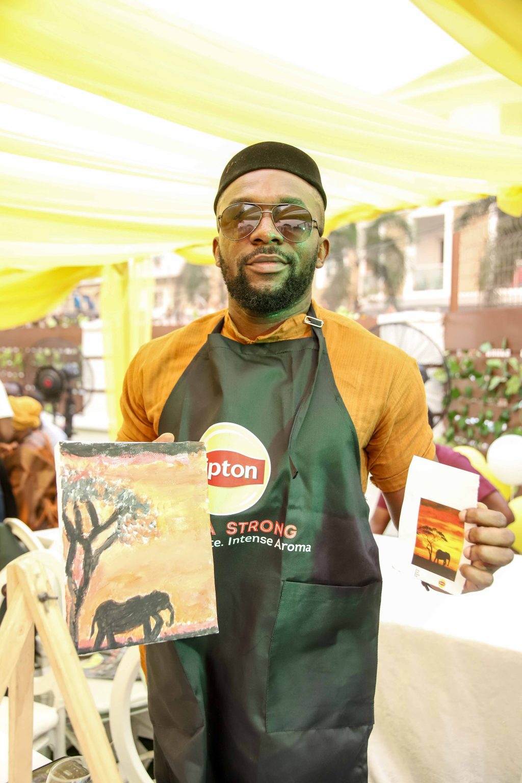 12. A guest presenting his artwork at the event